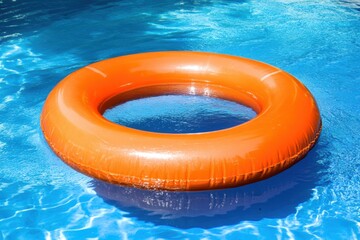 Bright orange pool float in sparkling blue water
