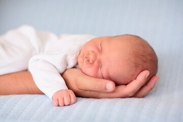 Newborn baby boy on a blue blanket