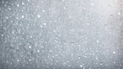 Fototapeta premium Water Droplets on Glass: Abstract background of water droplets scattered on a glass surface, capturing the essence of a soft, ethereal and misty atmosphere. The delicate drops create a sense of tranqu