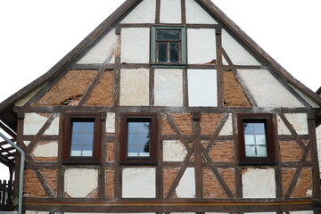 Street view of an old, typical half timbered gable, with the facade compartments classically filled...