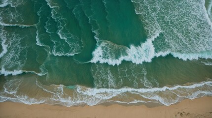 Fototapeta premium Aerial perspective showing calming turquoise waves gently touching sandy shore 