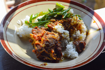 Close up of Indonesian cuisine with strong and abundant spices, rendang and beef curry