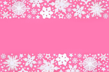 Christmas white snowflake and star decorative festive background on pink. Fantasy magical wonder design for the holiday season. Greeting card, gift tag, label. Copy space.