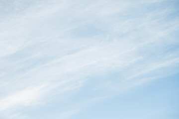 Milky sky with clouds resembling mist. Soft heaven texture of the sky. Hazy, foglike clouds...