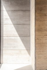 Fototapeta premium Raw concrete surface in warm tones with natural lighting and shadow interplay. Luxury interiors details.