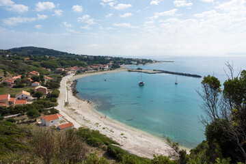 Obraz premium Amazing view down to the sea and the harbor village from the mountain in Othonoi island, Greece