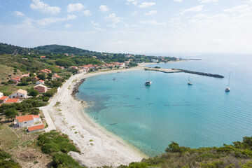 Obraz premium Amazing view down to the sea and the harbor village from the mountain in Othonoi island, Greece