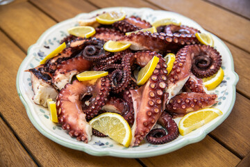 dish with octopus on the restaurant table