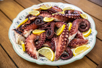 dish with octopus on the restaurant table