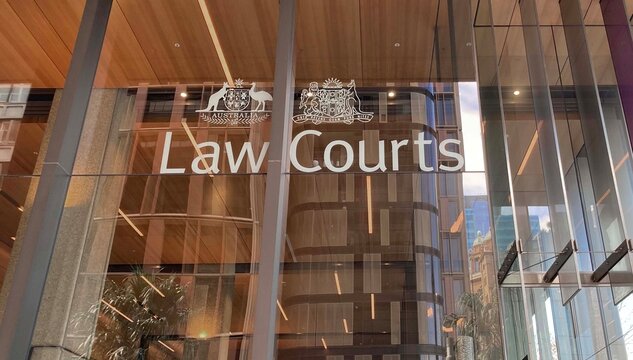 Sydney, NSW  Australia - April 28 2024: Glass front of the Supreme Court of New South Wales. Signage reading Law Courts