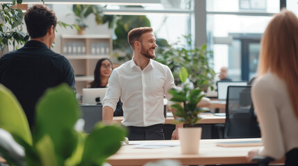 Team of businesspeople in an office setting, smiling and talking to each other, reflecting a collaborative and friendly work environment. This scene emphasizes the importance of te