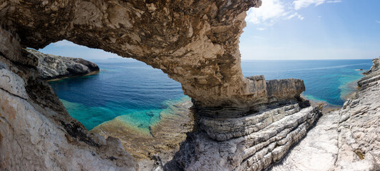 Fototapeta premium Amazing rocky formations and gorgeous sea waters of the south coastline in Othonoi island, Greece