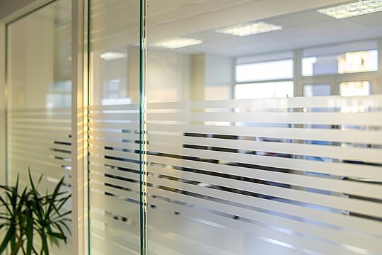 Striped frosted glass partition in modern office, light office b