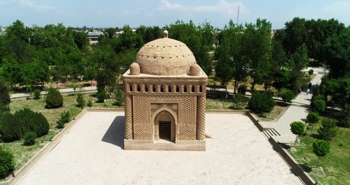 Drone flies around Ismoil Somoniy madrasah on a sunny day. Uzbekistan, Bukhara.