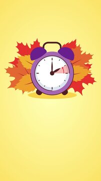 Switch to winter time. A clock with autumn leaves.