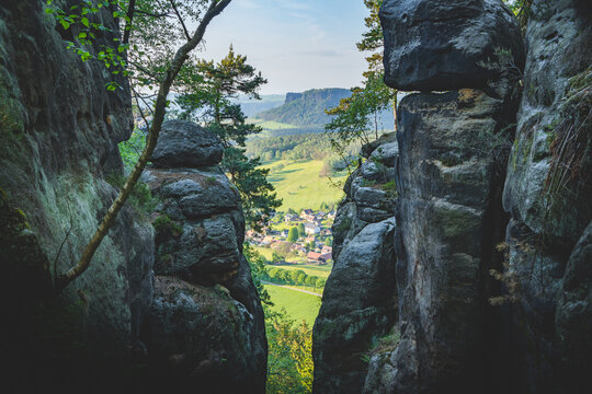 village between sandstone cliffs