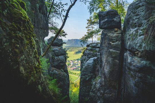 village between sandstone cliffs