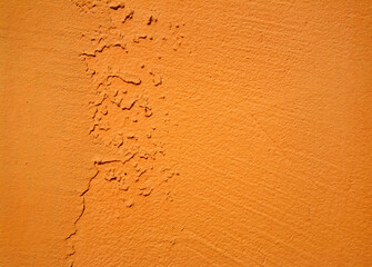 Background, texture of cracked, rough, painted red, orange old wall. Grunge, vintage surface, copy space.