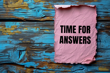 Time for answers words written on ripped pink paper with wooden background. Conceptual time for answers symbol. Copy space.