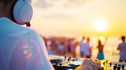 Vibrant Sunset Beach Party: DJ Energizing Crowd with Music as Vivid Skies Illuminate the Celebration