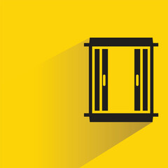 window with shadow on yellow background