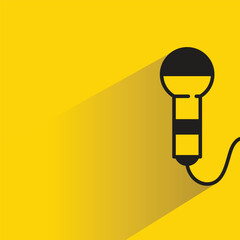 microphone icon with shadow on yellow background