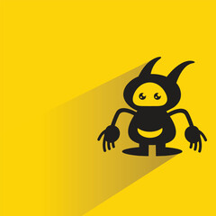 alien monster character with shadow on yellow background