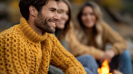 Obraz premium Cozy Autumn Evening: Friends Gathered Around Campfire in Sweaters, Creating Warm Nostalgic Atmosphere