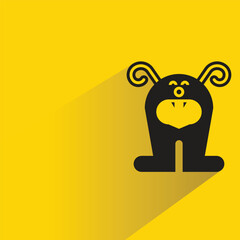 cute monster with shadow on yellow background