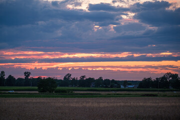 The sun setting on the Polish countryside. The sun setting.