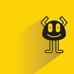 cute monster with shadow on yellow background