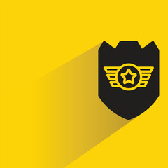 shield badge with shadow on yellow background