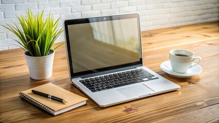 Fototapeta premium Modern laptop and notebook on a wooden desk with a blurred background, awaiting customer inquiries and support requests, representing a company's contact us page.