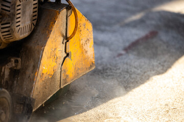 Close up view of circular construction machine cutting asphalt or concrete. Road maintenance and construction.