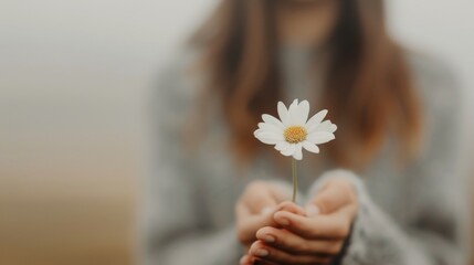 Young Woman Holding White Daisy Flower in Soft Morning Light Outdoors