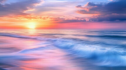 Fototapeta premium 62. A serene sunrise over a calm ocean with gentle waves and a soft, colorful sky