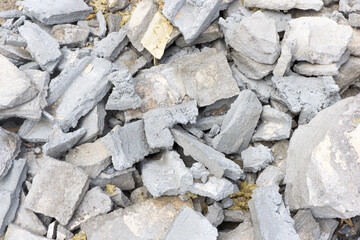 Post renovation debris. Concrete, brick, and gypsum fragments. Dirty dusty texture. Broken...