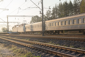 Fototapeta premium Old passenger train in the morning near the platform