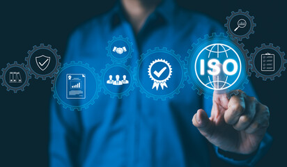 ISO Certification Concept. Businessman touch representation of ISO certification, icons symbolizing quality assurance, compliance, global standards, and International organization for standardization.