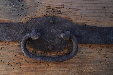 Close up of forged iron mountings up of a 400 year old wooden gothic chest