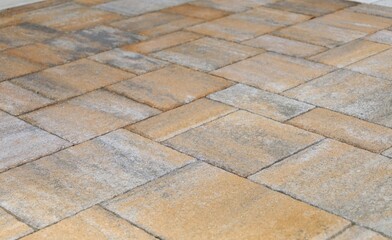 Orange and gray concrete paver blocks of different shapes. Stone effect for outdoor flooring,...