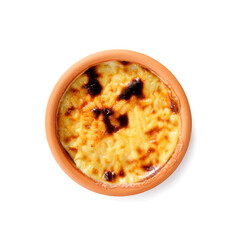 Baked rice pudding- traditional turkish milk dessert isolated on white background. top view