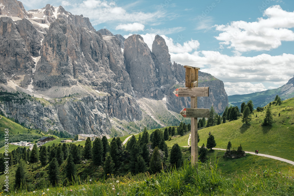 Wall mural view from the passo gardena to the big dolomite mountains of the sella group at summertime in italy.