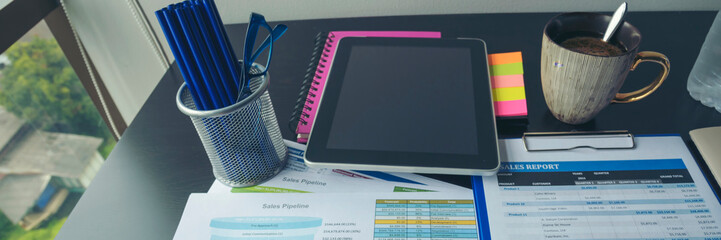 Banner Top view office desk laptop and coffee cup on wood table copy space.  Panorama tabletop...