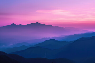 Fototapeta premium Majestic mountain range in a purple sunset haze