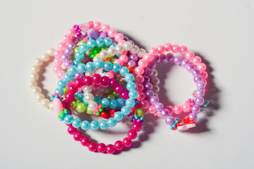 Beading workplace with hands in the process of handicraft. Beautiful diy jewelry and calming stress releasing hobby and activity