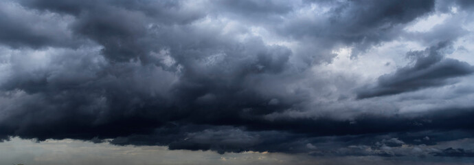 Banner Dramatic dark storm clouds black sky background. Dark thunderstorm clouds rainny season....