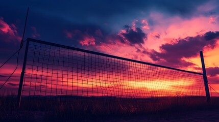 Volleyball Net Silhouette Against Dramatic Sunset Sky - A silhouette of a volleyball net stands tall against a vibrant sunset sky, capturing the essence of sport, competition, and the beauty of nature
