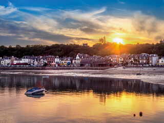 Serene coastal village of Cancale in french Brittany at sunset.
