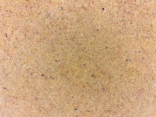 Close-up of particle board texture with detailed wood fibers in natural brown tone for professional and sleek visual designs